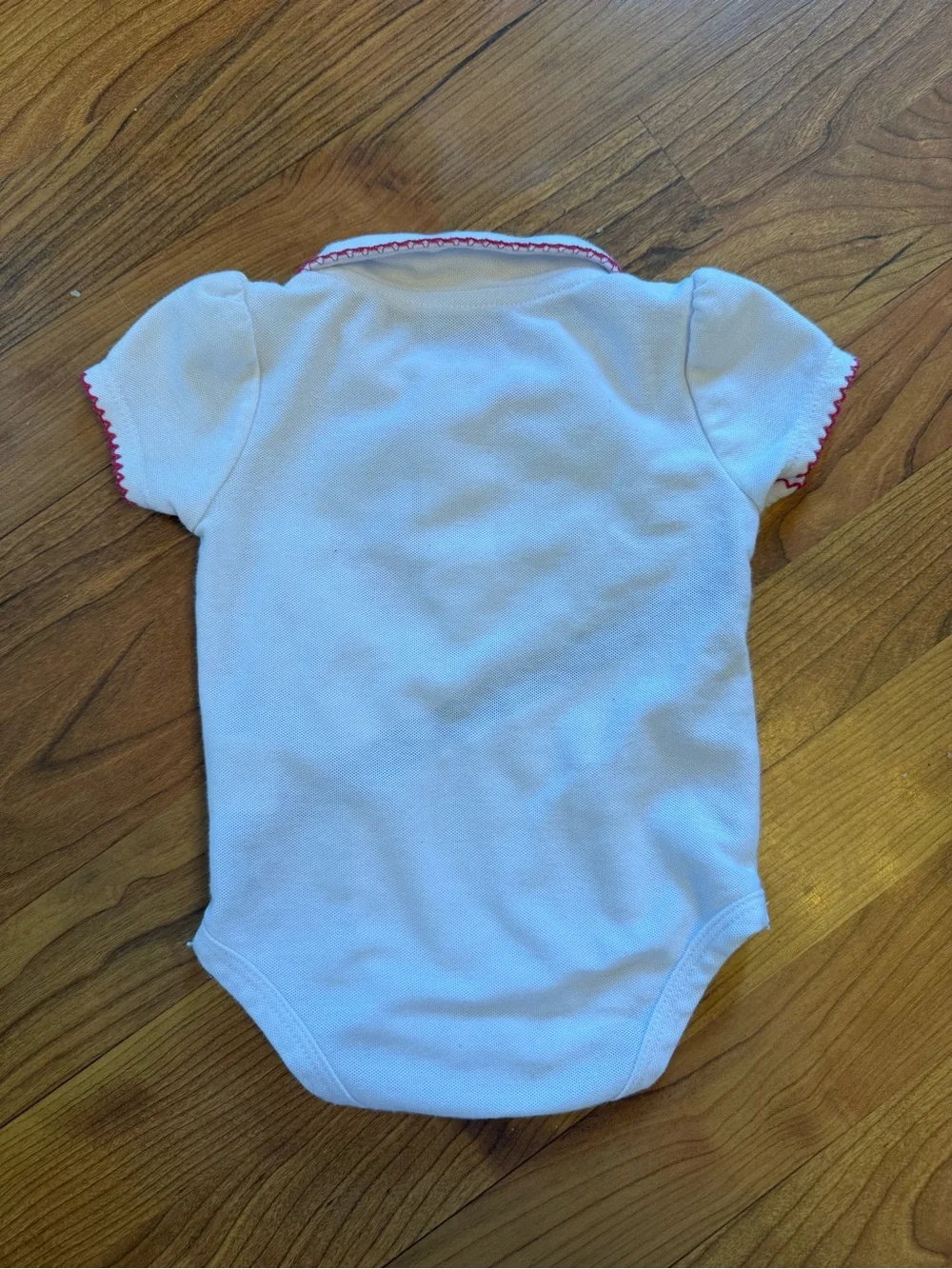 Beverly Hills Polo Club White Baby Onesie with Pink & Black Accents